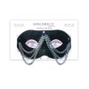 Sincerely Chained Lace Mask in black lace with draped silver chains on its retail card