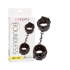 Boundless black vegan leather wrist cuffs with swivel clip beside the wrist cuffs retail box