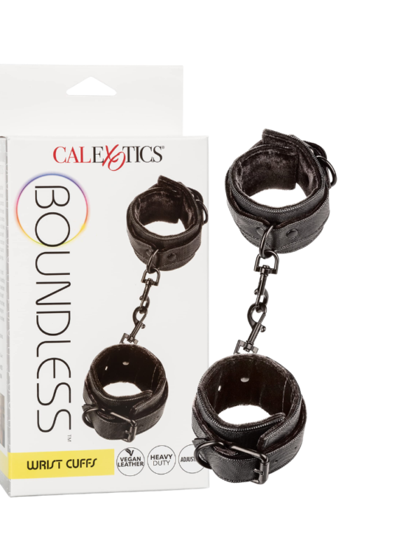 Boundless black vegan leather wrist cuffs with swivel clip beside the wrist cuffs retail box