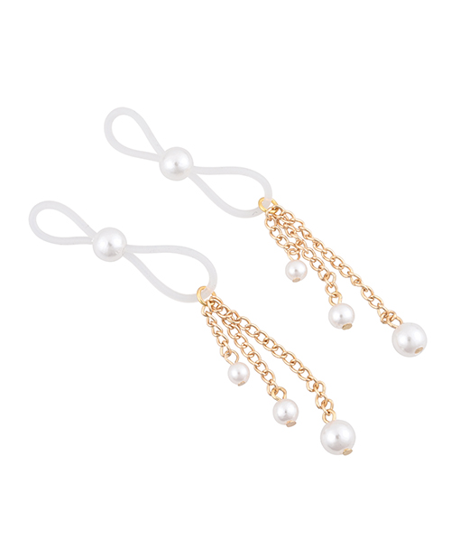 Pearl nipple ties lying flat showing the gold chains and faux pearl drops