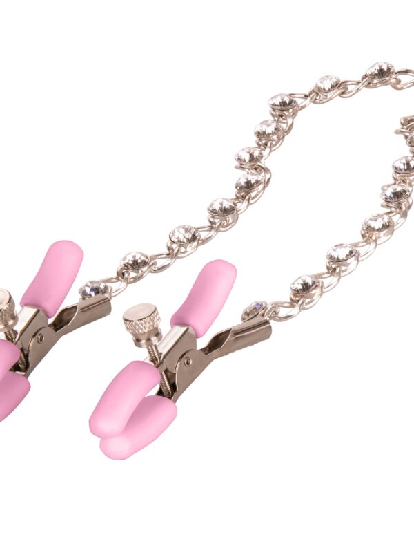 Close view of the pink silicone tips and crystal chain on the beginner nipple clamps