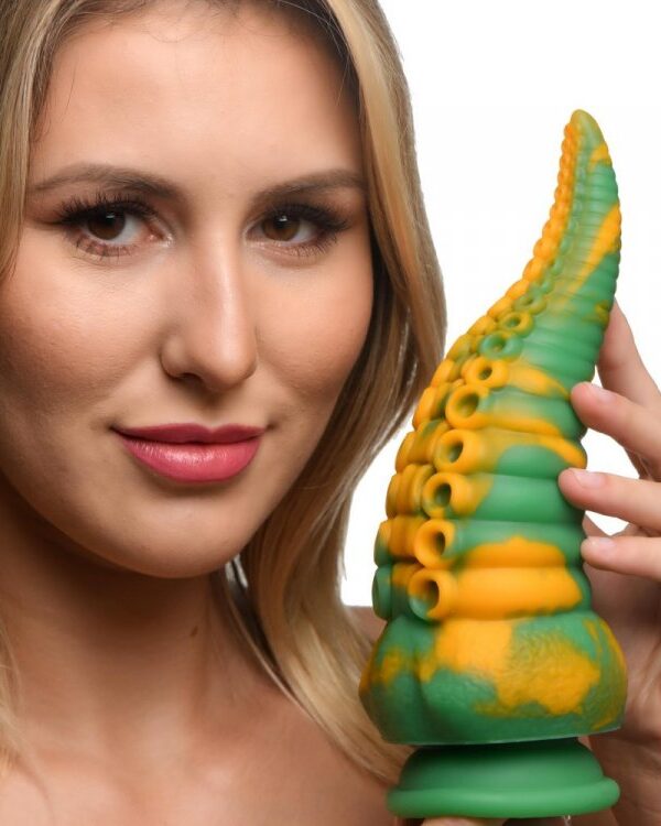 Woman holding the Monstropus octopus dildo to show its size
