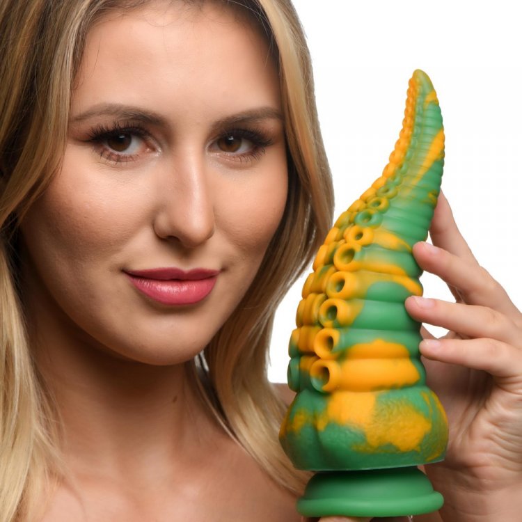 Woman holding the Monstropus octopus dildo to show its size