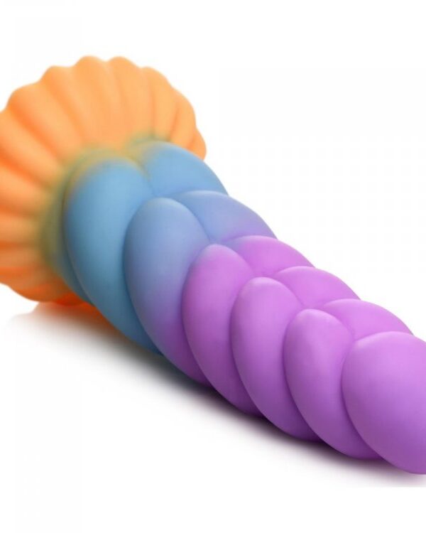 Mystique unicorn dildo lying on its side showing the spiral ridges