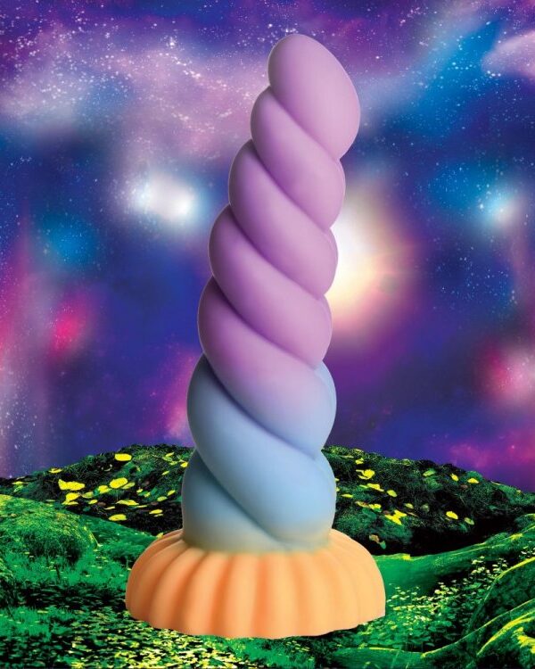 Mystique unicorn horn dildo standing in a starry fantasy landscape