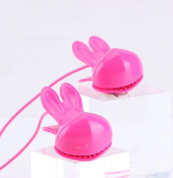 Close view of the pink bunny-ear silicone clips on the Molli necklace