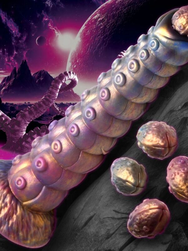 Deep Invader suckered tentacle ovipositor lying on rocks beside its silicone eggs