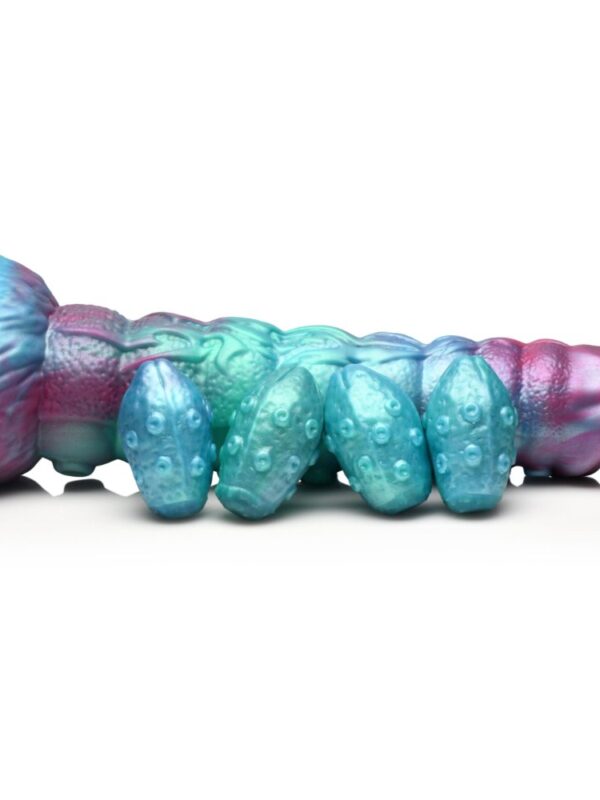 Side view of the Galactic Breeder showing its segmented shaft and the eggs beside it