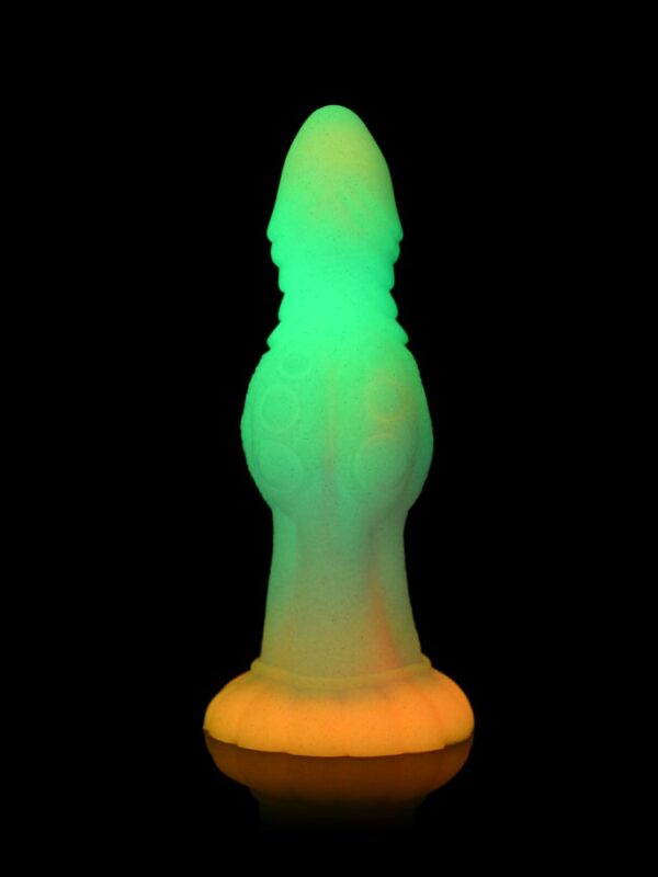 Galactic Cock alien dildo glowing green in the dark