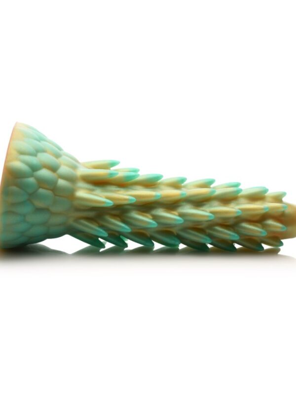 Side profile of the Stegosaurus dildo showing the spikes angled back toward the base