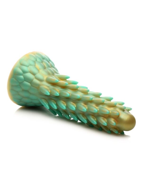 Stegosaurus dildo lying on its side showing the scaly suction cup base