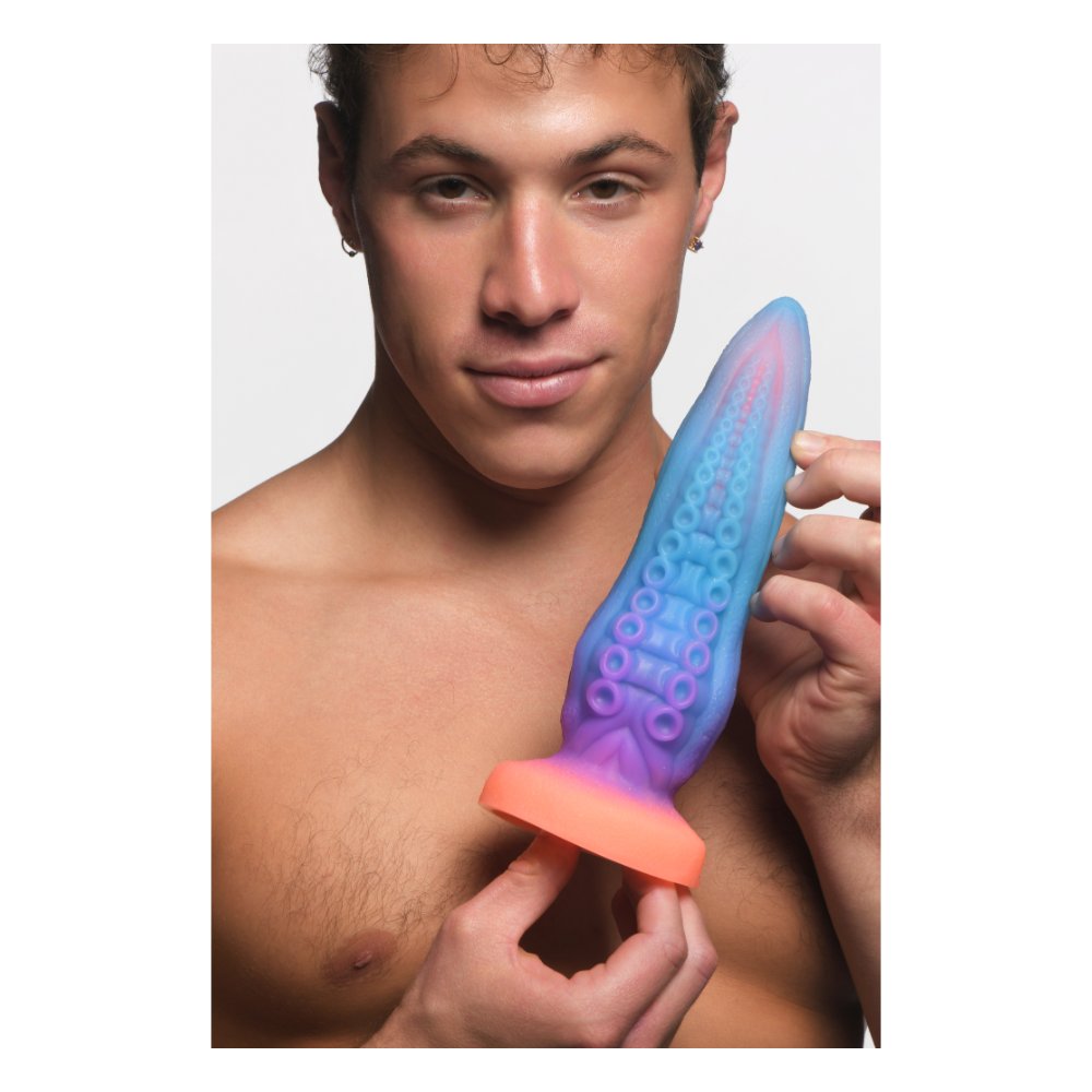 Man holding the Tenta-Cock tentacle dildo to show its size